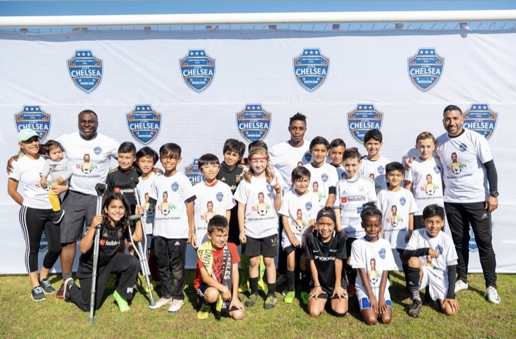Youth football group with coaches