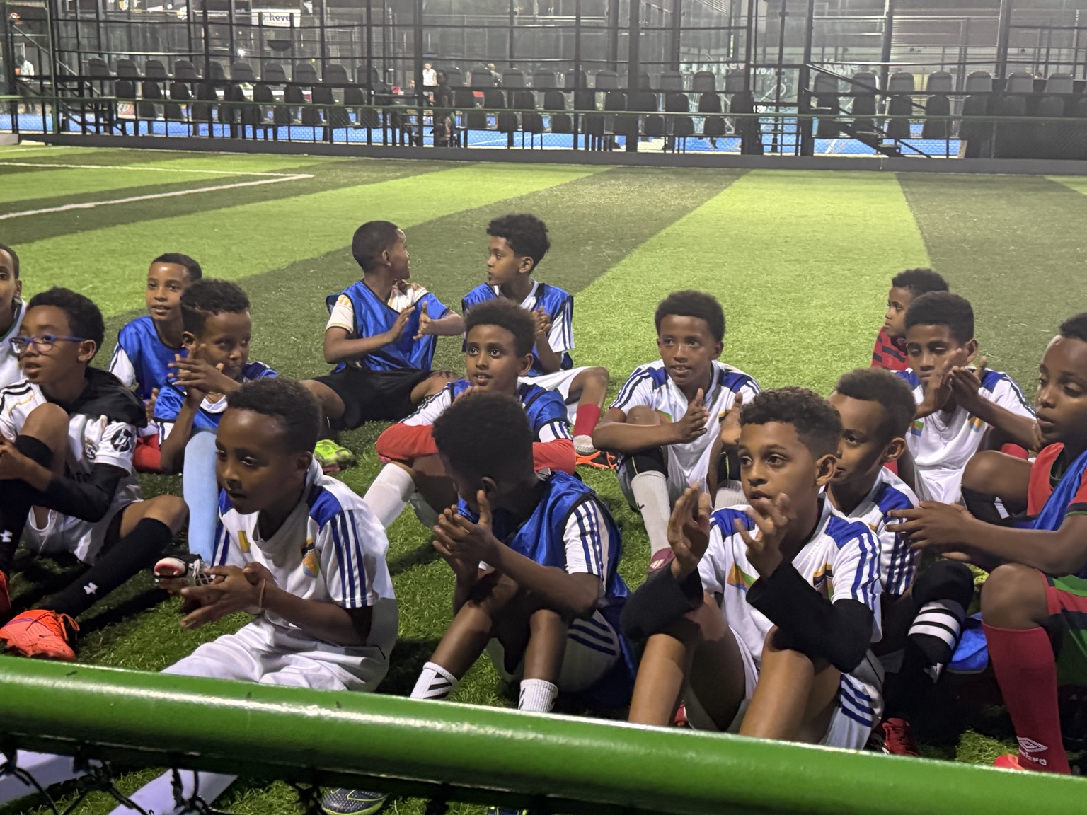 Young Eritrean footballers gathered on a pitch in Angola
